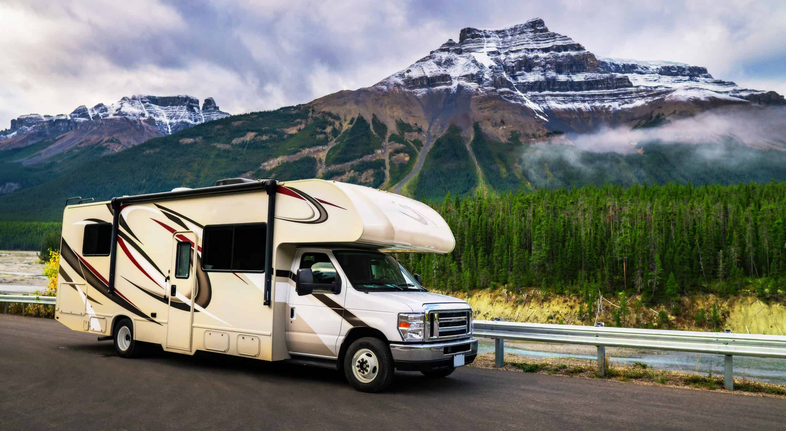 RV parked in front of a mountain